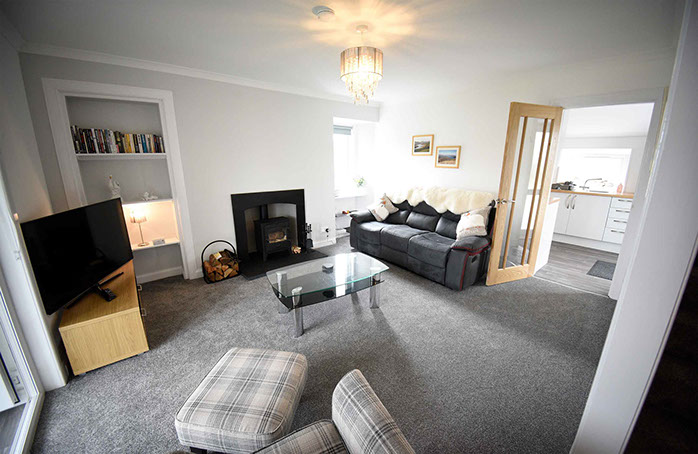 Tigh Beag Na Mara Self Catering Accommodation Living Room with Smart TV Woodburning Stove Sea Views and WIFI Internet access